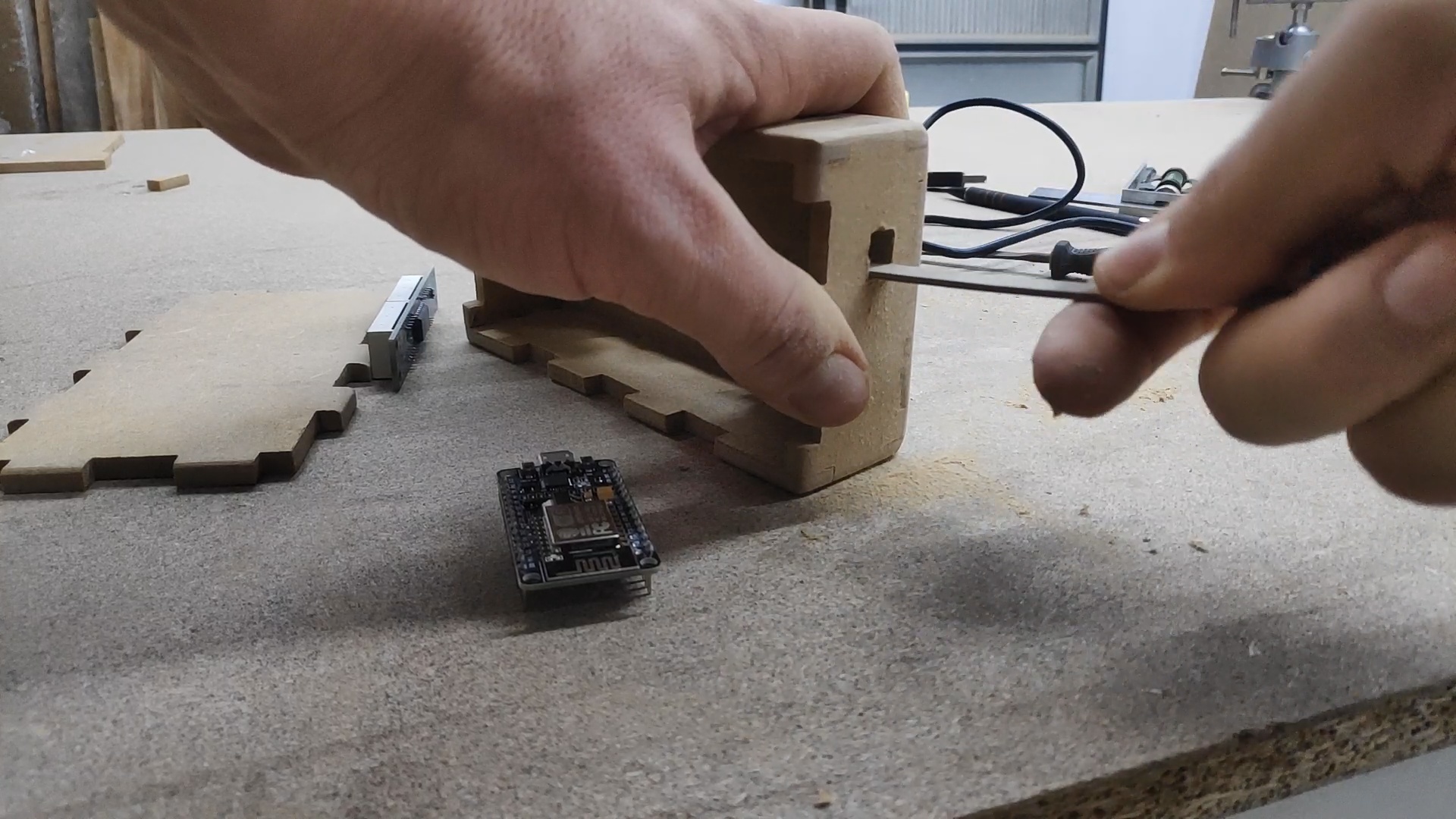 Preparing the cutouts for the display, the cable and the push button.